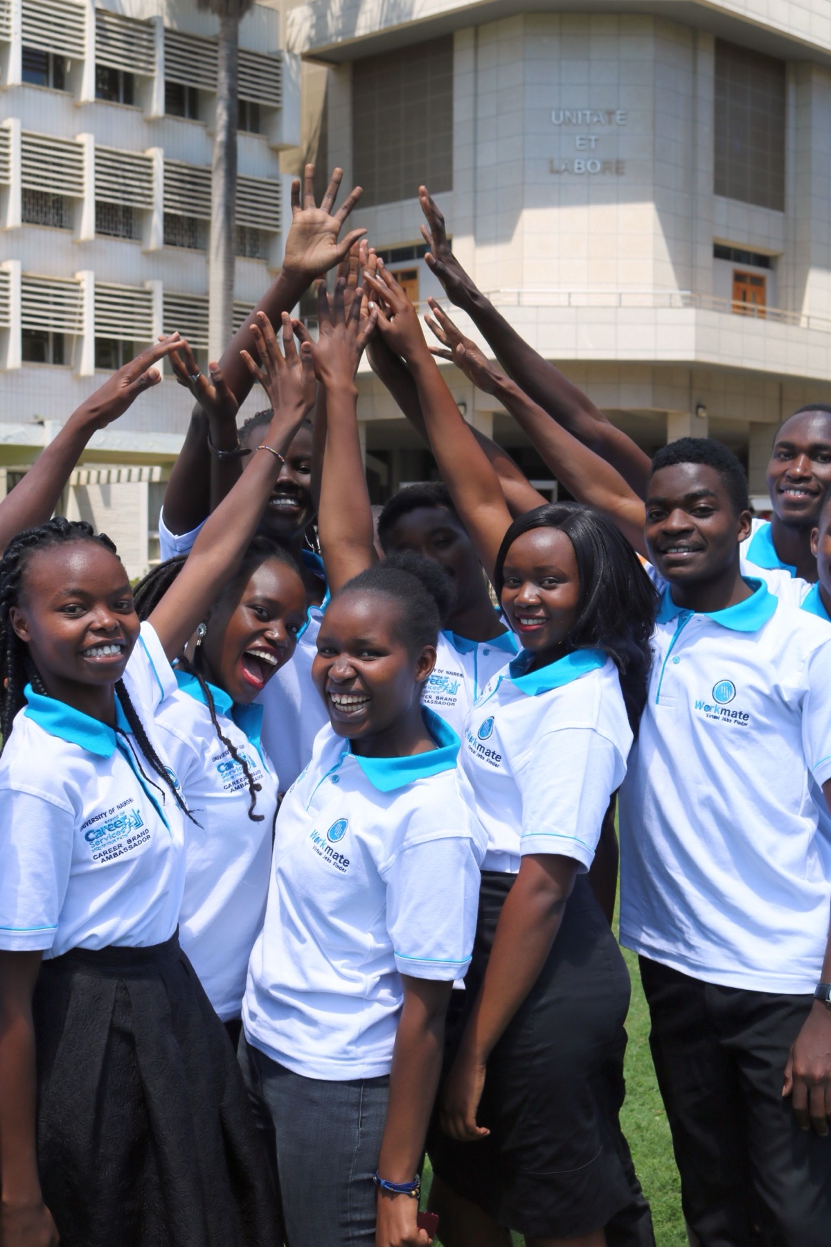 Workmate trainees raising their hands after a training session